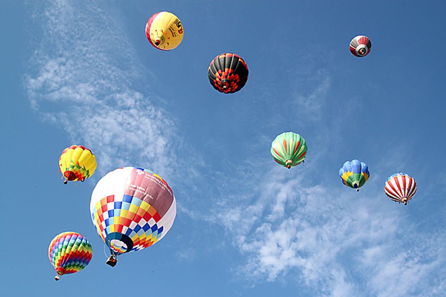Hot air balloons fill the sky during the Albuquerque International Balloon Fiesta in Albuquerque, N.M., on Saturday, Oct. 2, 2010. (AP Photo/Susan Montoya Bryan)
