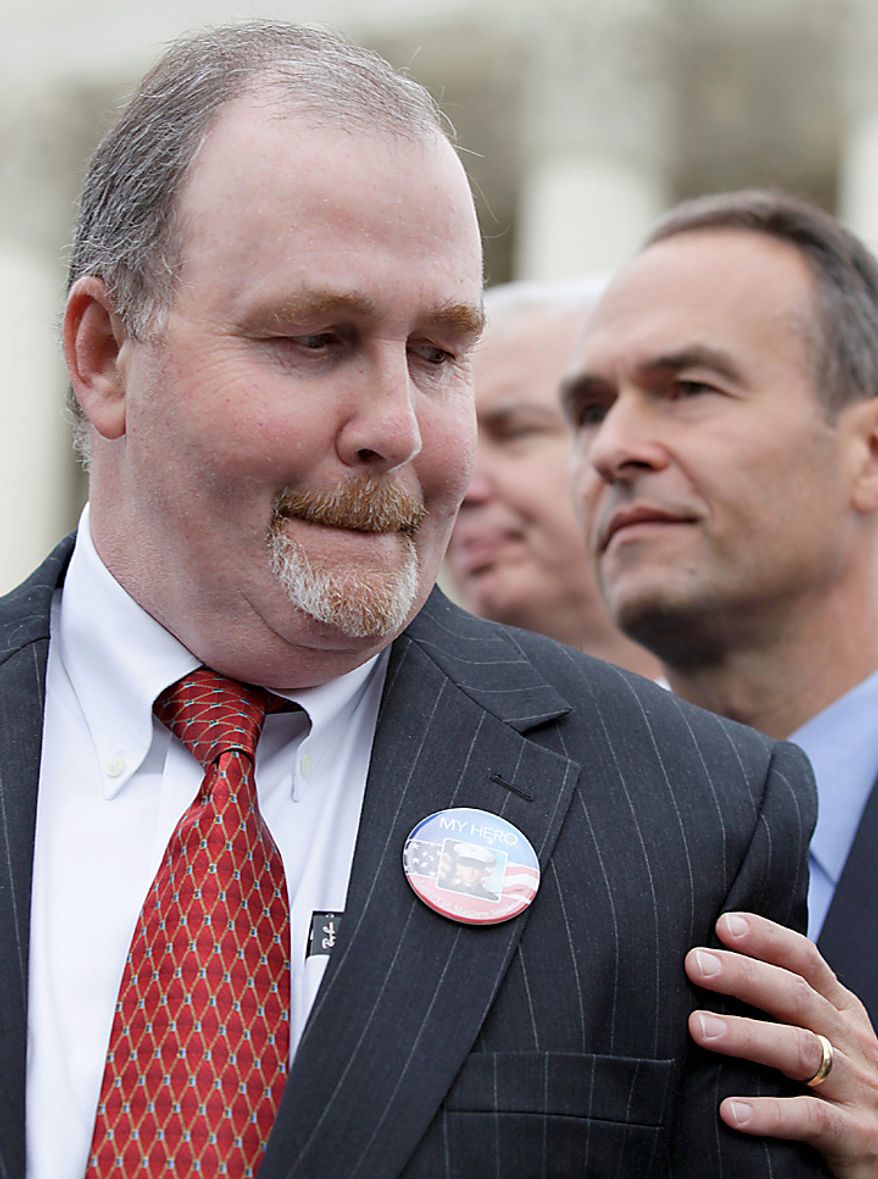 Albert Snyder of York, Pa., left, steps aside after making a statement in front of the Supreme Court in Washington, Wednesday, Oct. 6, 2010, after the court heard arguments in the dispute between Snyder and the Westboro Baptist Church of Topeka, Kan. At right is Kansas Attorney Gen. Stephen Six. (AP Photo/Carolyn Kaster)