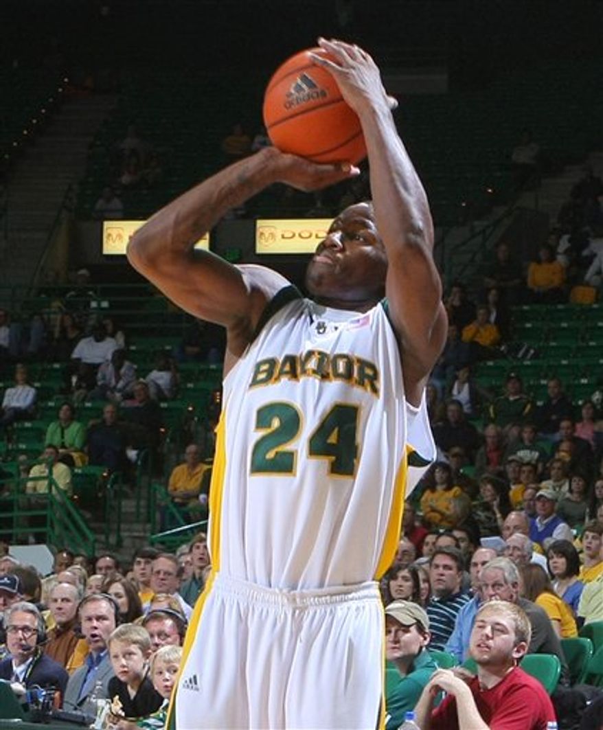 FILE - In a Nov. 24, 2008, file photo, Baylor's LaceDarius Dunn shoots against Jacksonville in second half of an NCAA college basketball game in Waco, Texas. Baylor indefinitely suspended Dunn on Tuesday, Oct. 5, 2010, after he surrendered to police to face an aggravated assault charge accusing him of breaking his girlfriend's jaw during an argument last week. (AP Photo/ Waco Tribune Herald, Jerry Larson, File)