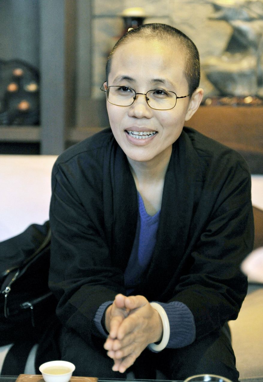 Liu Xia, wife of Chinese dissident Liu Xiaobo, is seen here Oct. 4, before her husband was awarded the Nobel Peace Prize. (Associated Press)