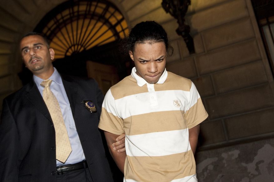 Brian Cepeda (right), 16, and eight others face charges including robbery, assault and unlawful imprisonment as hate crimes in the torture of two teenage boys and a man in an anti-gay attack last week. (AP Photo/Uli Seit)