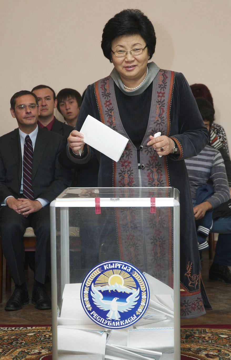 Kyrgyz President Roza Otunbayeva casts her ballot at a polling station in Bishkek, Kyrgyzstan, the nation's capital, on Sunday, Oct. 10, 2010. (AP Photo/Maxim Shubovich)