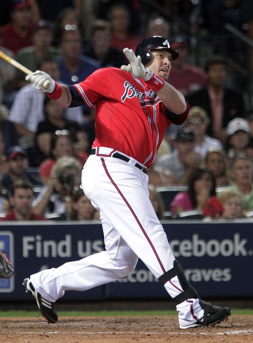 ASSOCIATED PRESS Atlanta Braves' Eric Hinske watches his two-run home run in the eighth inning against San Francisco Giants pitcher Sergio Romo during Game 3 of baseball's National League Division Series on Sunday, Oct. 10, 2010, in Atlanta.