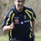 FILE - In htis March 23, 2010, file photo, FC Sochaux soccer player Charlie Davies, of the United States, jogs during a training session at the Auguste Bonal stadium in Montbeliard, eastern France. American forward Charlie Davies said he was not the driver of a car stopped for going 125 mph last weekend, but told French police he was to protect a teammate.   Davies, who nearly died in a car crash last year, told The Associated Press on Saturday, Oct. 9, 2010, that Jacques Faty, his teammate at French club Sochaux, asked him to switch places and tell police he was driving because Faty thought his license was still suspended from a previous speeding infraction. (AP Photo/Mathieu Cugnot, File)