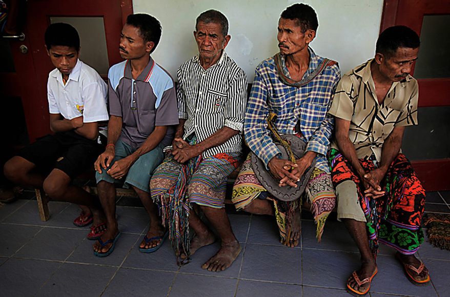 In this photo taken on Tuesday July 6, 2010, leprosy patients wait to be examined at a health center, in Oe-sillo, 14 kilometers (9 miles) west of Oe-cusse, East Timor. East Timor is one of just two places worldwide where leprosy is still widespread, and the country has now declared war on the age-old scourge. (AP Photo/Wong Maye-E)