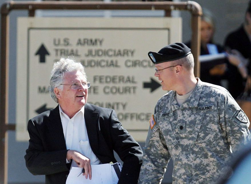 John Galligan (left), the defense attorney for Maj. Nidal Malik Hasan, leaves the U.S. Magistrate court where an Article 32 hearing for Maj. Hasan was being held on Tuesday in Fort Hood, Texas. (Associated Press)