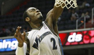 **FILE** Washington Wizards point guard John Wall goes to the basket during the fourth quarter of an NBA preseason basketball game against the Atlanta Hawks in Washington on Oct. 12, 2010. (Associated Press)