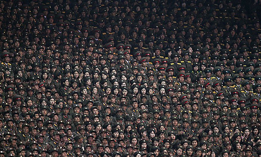 North Korean solders attend a Arirang mass games to mark the 65th anniversary of the communist nation's ruling Workers' Party in Pyongyang, North Korea on Saturday, Oct. 9, 2010. Leader Kim Jong Il brought dancers at the Arirang mass games to tears Saturday by making a rare appearance at the festival on the second day of celebrations in the North Korean capital. (AP Photo/Vincent Yu)