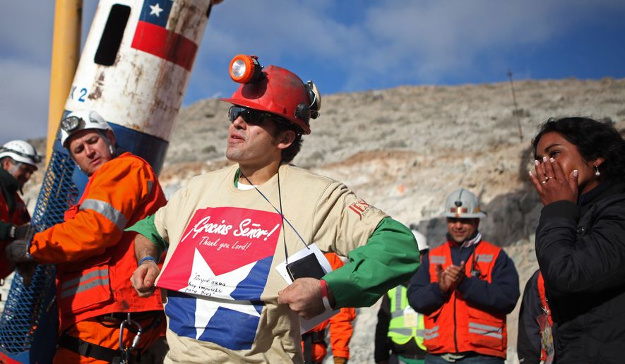 In this photo released by the Chilean government, miner Alex Vega reacts Wednesday after being rescued from the collapsed San Jose gold and copper mine near Copiapo, Chile, where he and 32 other miners had been trapped for more than two months. (Associated Press/Hugo Infante, Chilean government)