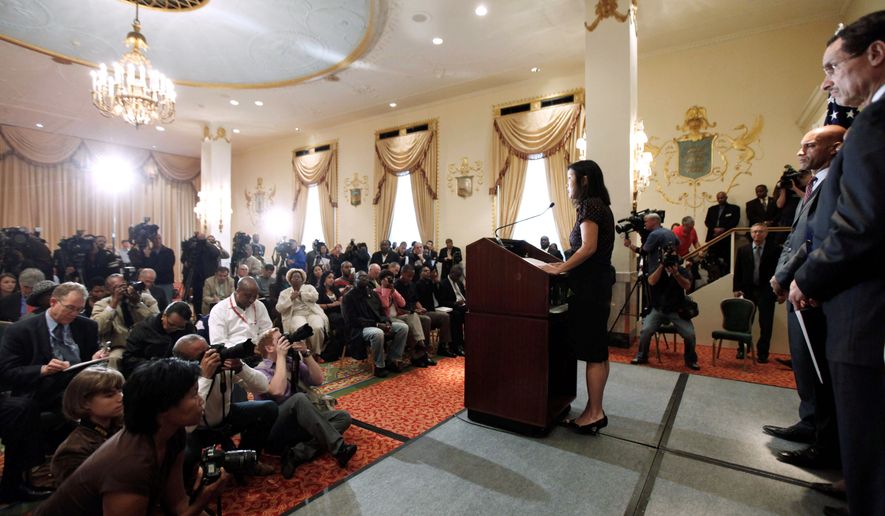 Michelle Rhee, the head of the D.C. public school system (center), announces her resignation on Wednesday. D.C. City Council Chairman Vincent C. Gray (far right) and Mayor Adrian M. Fenty look on. (Associated Press)