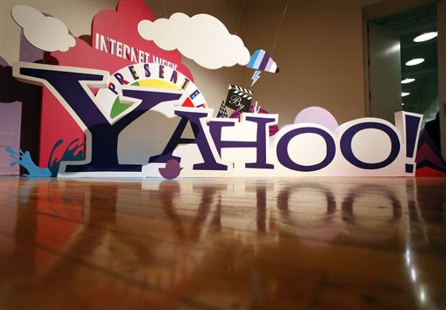 FILE - This file photo made June 7, 2010, shows a sign for Yahoo! in New York. Investors are running up the price of Yahoo shares Thursday, Oct. 14, 2010, after a report saying AOL and a group of private equity firms may bid for the Web company. (AP Photo/Mark Lennihan, file)