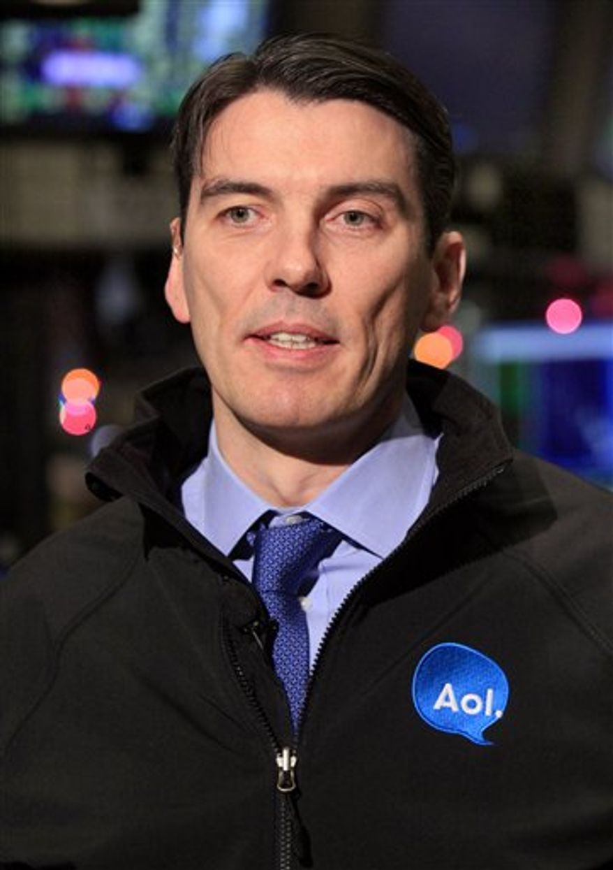 FILE - In this Dec. 10, 2010 file photo, AOL Chairman and CEO Tim Armstrong is seen on the floor of the New York Stock Exchange. Investors are running up the price of Yahoo Inc. shares after a report saying AOL Inc. and a group of private equity firms may bid for the Web company.(AP Photo/Richard Drew, file)