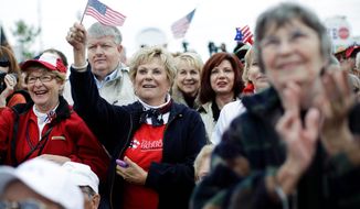 ASSOCIATED PRESS PHOTOGRAPHS
Attendees show their support during a rally launching a Tea Party Express bus tour Monday in Reno, Nev. The tour will make stops in at least 15 states before reaching Concord, N.H., the day before the midterm elections.