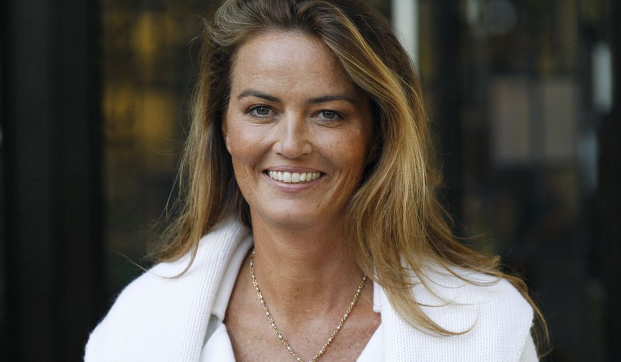 German heiress Katrin Radmacher leaves the Supreme Court in London Wednesday, Oct. 20, 2010, after the court ruled in her favor in a divorce case that gives new validity to prenuptial agreements in England. (AP Photo/Sang Tan)