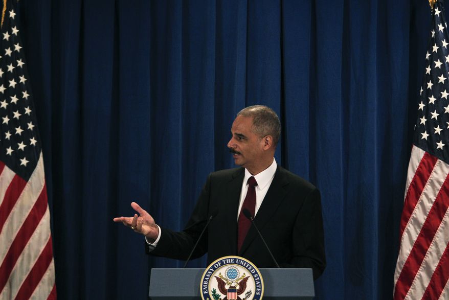 U.S. Attorney General Eric H. Holder Jr. speaks during a press conference at the U.S. Embassy in Beijing, China, Thursday, Oct. 21, 2010. (AP Photo/Alexander F. Yuan)