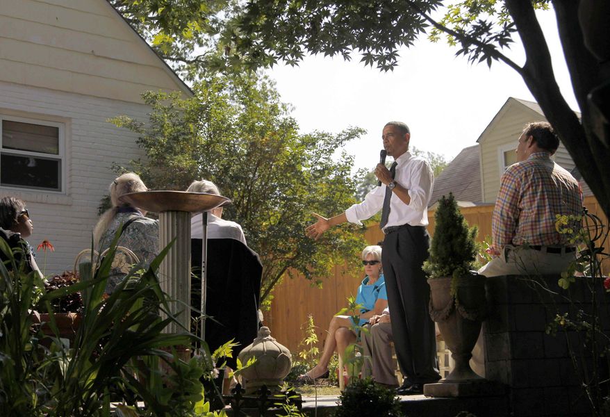 ** FILE ** In this Sept. 22, 2010, file photo President Barack Obama, accompanied by Health and Human Services Secretary Kathleen Sebelius, center, speaks at a private residence in Falls Church, Va. (AP Photo/Pablo Martinez Monsivais, File)