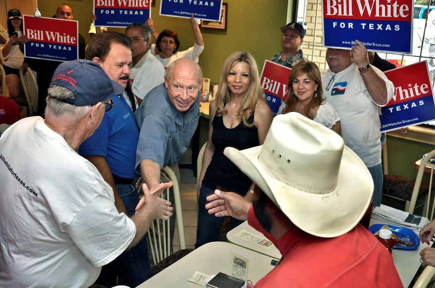 Associated Press photographs
Texas Democratic gubernatorial candidate Bill White (center) greets supporters Saturday at Los Generales Restaurant in Laredo, Texas, before joining them on a walk throughout Laredo's west side.