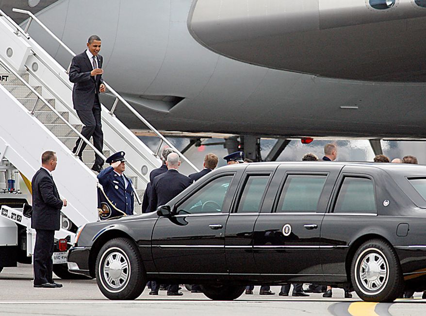 President Barack Obama exits Air Force One at T.F. Green Airport in Warwick, R.I., Monday, Oct. 25, 2010. Obama will tour a factory in Woonsocket, R.I., and attend two fundraisers in Providence, R.I. (AP Photo/Stew Milne)
