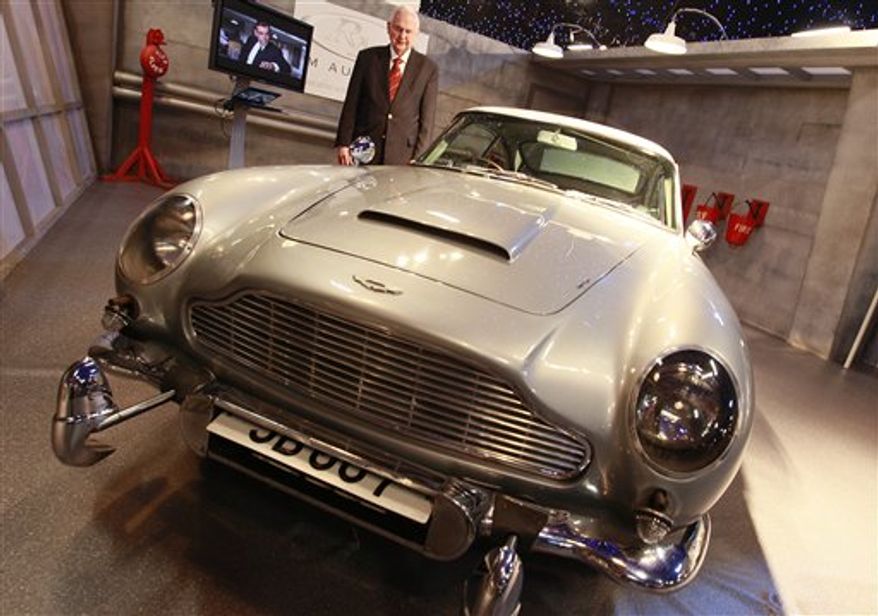 The 'James Bond' 1964 Aston Martin DB5, is viewed by the media, in London, Tuesday, Oct. 26, 2010. The car which was the road car in the Bond movie 'Goldfinger and the effects car in ' Thunderball ' both staring Sean Connery is expected to sell for around $5.5 million (euro3.9 million), at auction in London, Thursday, Oct. 27. (AP Photo/Alastair Grant)