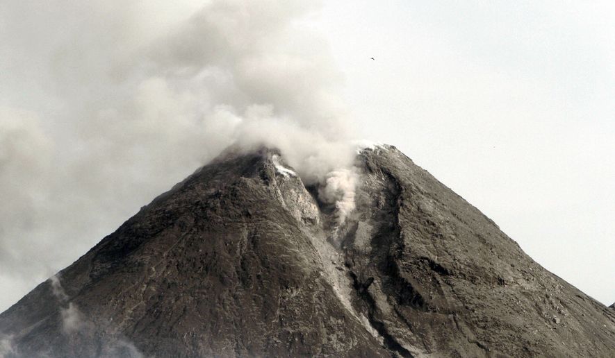 Mount Merapi spews volcanic smoke as seen from Cangkringan, Yogyakarta, Indonesia, Saturday, Oct. 30, 2010. (AP Photo/Irwin Fedriansyah)
