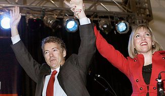 Sen.-elect Rand Paul. R-Ky., and his wife Kelley arrive at his victory celebration in Bowling Green, Ky., Tuesday, Nov. 2, 2010.  (AP Photo/Ed Reinke)