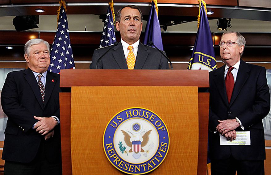 House speaker-in-waiting Rep. John Boehner, R-Ohio, center, accompanied by Senate Minority Leader Mitch McConnell of Ky., right, and Mississippi Gov. Haley Barbour, speaks during a news conference on Capitol Hill in Washington, Wednesday, Nov. 3, 2010. (AP Photo/Alex Brandon)