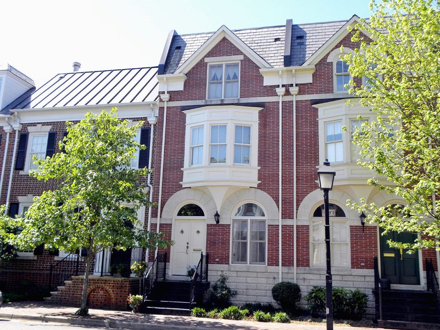 The home at 814 Cameron St. in Alexandria is on the market for $925,000. Built in 1995, it is one of 16 all-brick Colonial-style town homes known at Church Square.