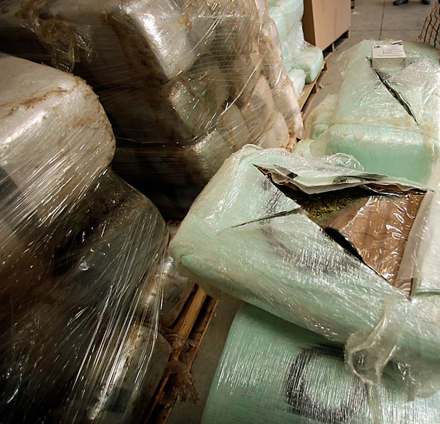 **FILE** An open bundle of marijuana seized at a warehouse in San Diego along the border between the United States and Mexico on Nov. 3, 2010, is seen here. A 600-yard tunnel was discovered in the warehouse. U.S. authorities found 20 tons of marijuana near the tunnel. (Associated Press)