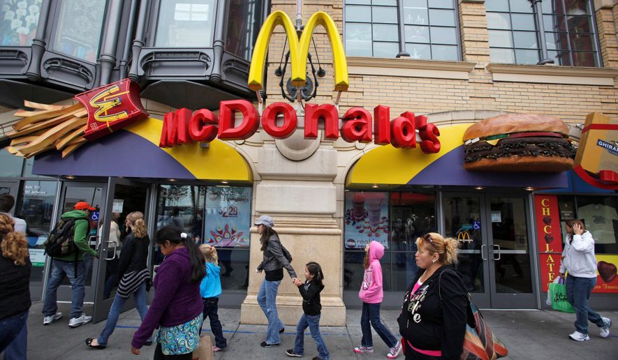 The McDonald&#39;s restaurant at Fisherman&#39;s Wharf in San Francisco attracts people with children. The recession-driven search for value is boosting patronage at fast-food restaurants. (Associated Press)