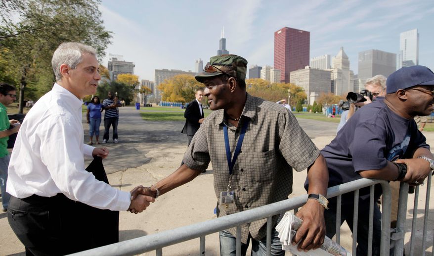 Former Obama White House Chief of Staff Rahm Emanuel shakes hands Oct. 11 along the route of Chicago's Columbus Day parade as he prepares to run to replace outgoing Mayor Richard M. Daley. (Associated Press)