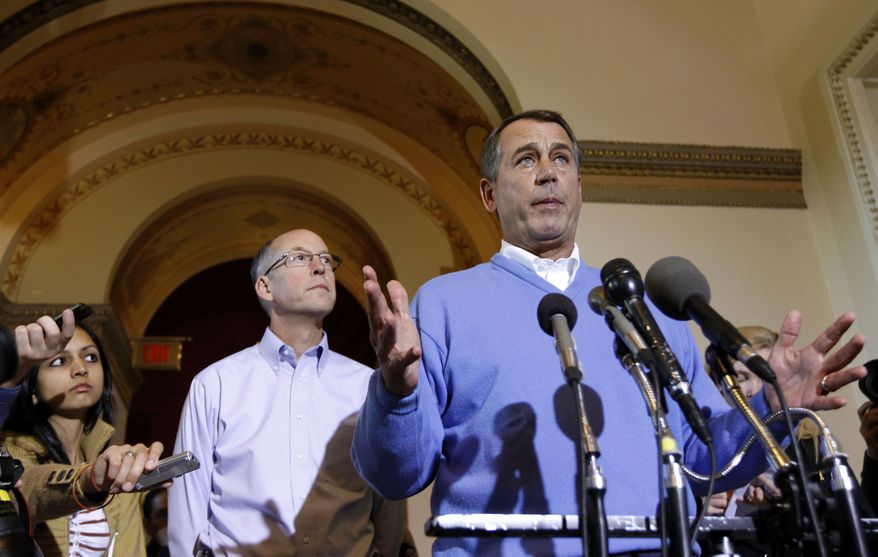 House Speaker-in-waiting John Boehner of Ohio, right, accompanied by Republican Majority Transition Chairman Rep. Greg Walden, R-Ore., speaks during a news conference on Capitol Hill in Washington on Wednesday, Nov. 10, 2010. (AP Photo/Alex Brandon)