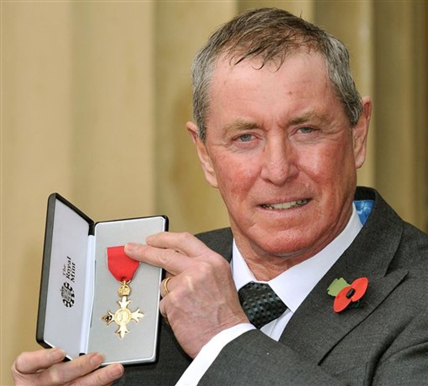 Actor John Nettles holds the insignia of Officer of the British Empire (OBE) medal, after it was presented to him by Britain's Queen Elizabeth II, at an investiture at Buckingham Palace in London, Tuesday Nov. 9, 2010. Nettles, 67, the star of two long-running television series 'Bergerac' and 'Midsomer Murders', was awarded the honour for services to drama.(AP Photo/Stillwell, pool)