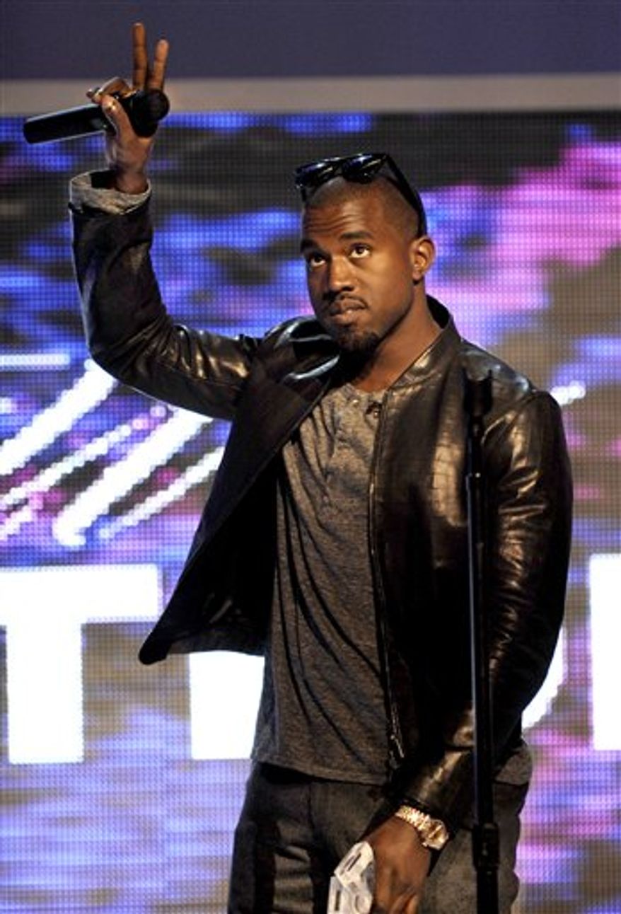 FILE - In this June 11, 2009 file photo, Kanye West performs for the Kanye West Foundation at the Chicago Theatre in Chicago. (AP Photo/Paul Beaty, file)