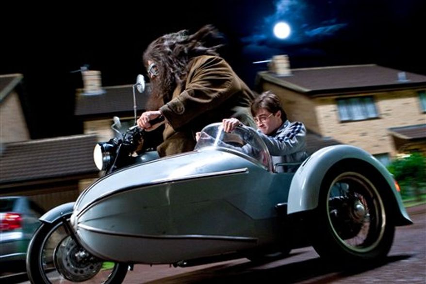 In this film publicity image released by Warner Bros. Pictures, Robbie Coltrane, left, and Daniel Radcliffe are shown in a scene from "Harry Potter and the Deathly Hallows: Part 1." (AP Photo/Warner Bros. Pictures, Jaap Buitendijk) NO SALES