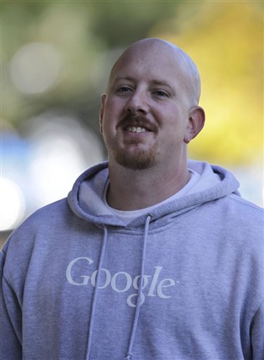 Google workers walk on the company's Mountain View, Calif. campus Wednesday, Nov. 10, 2010. Google Inc. is giving all 23,300 of its employees 10 percent raises next year and shifting part of worker's annual bonuses into their regular paychecks, according to an internal memo sent Tuesday by Google CEO Eric Schmidt. Those bonuses won't count toward the 10 percent. (AP Photo/Paul Sakuma)