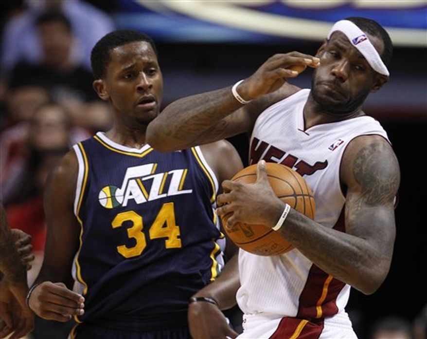 Miami Heat shooting guard Dwyane Wade is shown during the second half of an NBA basketball game against the Utah Jazz Tuesday, Nov. 9, 2010 in Miami. The Jazz defeated the Heat 116-114 in overtime. (AP Photo/Wilfredo Lee)