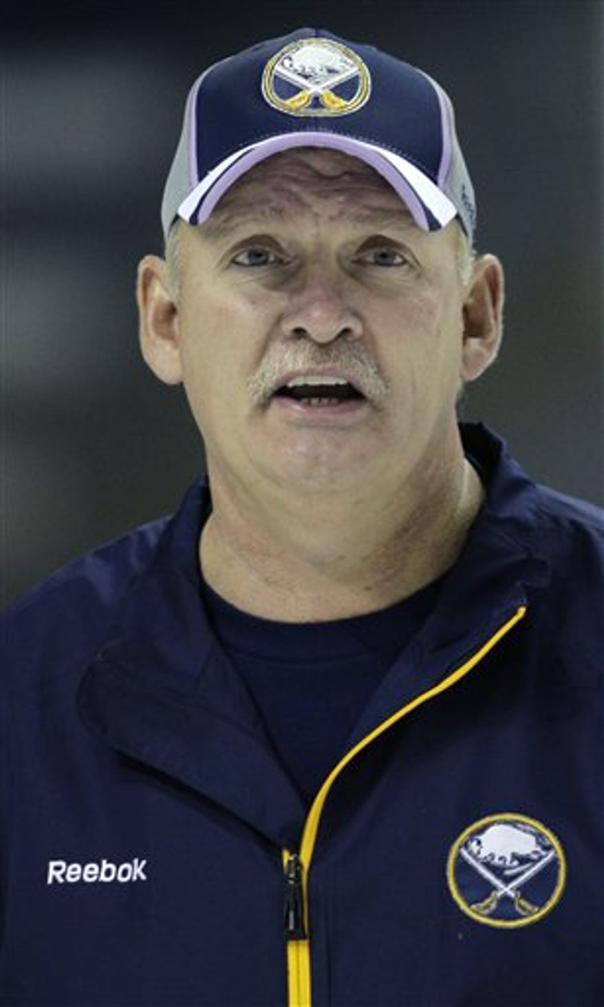 FILE - This Oct. 6, 2010, file photo shows Buffalo Sabres coach Lindy Ruff during NHL hockey practice in Buffalo, N.Y. Ruff is set become only the third NHL coach to reach 1,000 games with one team. The milestone comes Wednesday, Nov. 10, 2010, when Buffalo plays at New Jersey. (AP Photo/David Duprey, File)