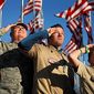 Chief Master Sgt. Bill Ross, a 35-year Air Force veteran, left, and Boy Scouts 19-year-old Tyler Pollock, and 12-year-old Liam Gallagher salute in honor of war veterans, Thursday, Nov. 11, 2010, in Freeport, Maine.  The boy scouts and other volunteers raised 50 casket flags donated by the families of Freeport veterans. (AP Photo/Robert F. Bukaty)