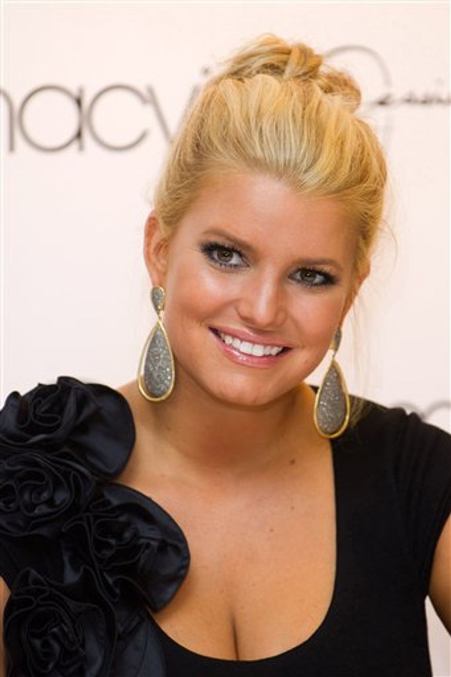 FILE -- In a Sept. 15, 2010 file photo Jessica Simpson appears at the launch of Macy's "Find Your Magic" campaign in New York. Jessica Simpson representatives Lauren Auslander and Cindi Berger tell The Associated Press that the singer and sometime actress is engaged to former NFL player Eric Johnson. (AP Photo/Charles Sykes/file)