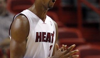 Miami Heat&#39;s LeBron James (6) drives around Toronto Raptors&#39; DeMar DeRozan (10) during the second half of  a NBA basketball game in Miami, Saturday, Jan. 22, 2011.  The Heat defeated the Raptors 120-103. (AP Photo/J Pat Carter)
