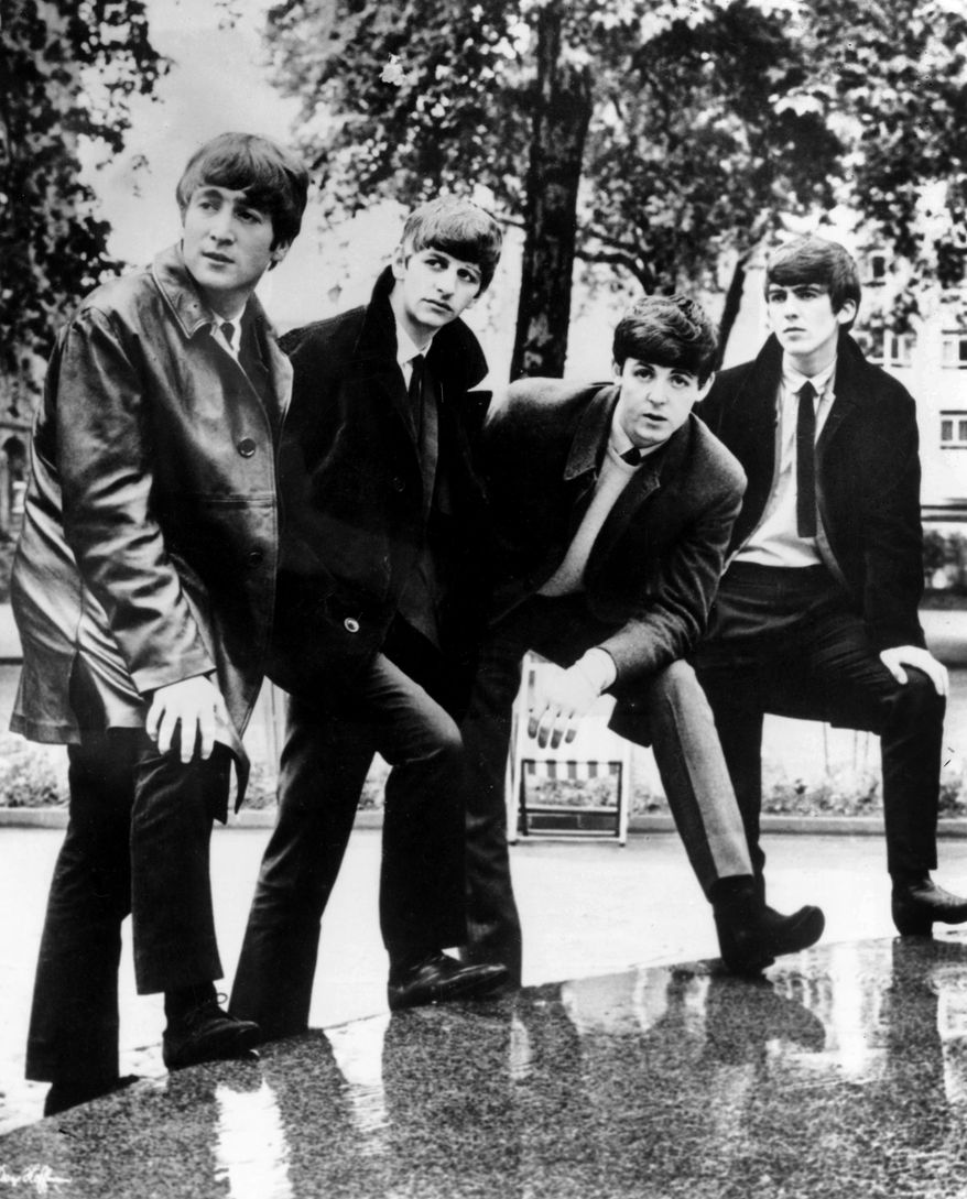 In this undated file photograph British pop band The Beatles, John Lennon (left) Ringo Starr, Paul McCartney and George Harrison (right) pose for a photograph. Apple Inc. said Tuesday, Nov. 16, 2010, its iTunes service will sell music from the Fab Four. The Beatles have so far been the most prominent holdout from iTunes and other online music services. (AP Photo/file)
