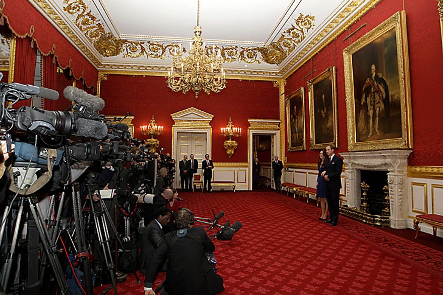 Britain's Prince William and his fiancee Kate Middleton pose for the media at St. James's Palace in London, Tuesday Nov. 16, 2010, after they announced their engagement. The couple are to wed in 2011. (AP Photo/Sang Tan)