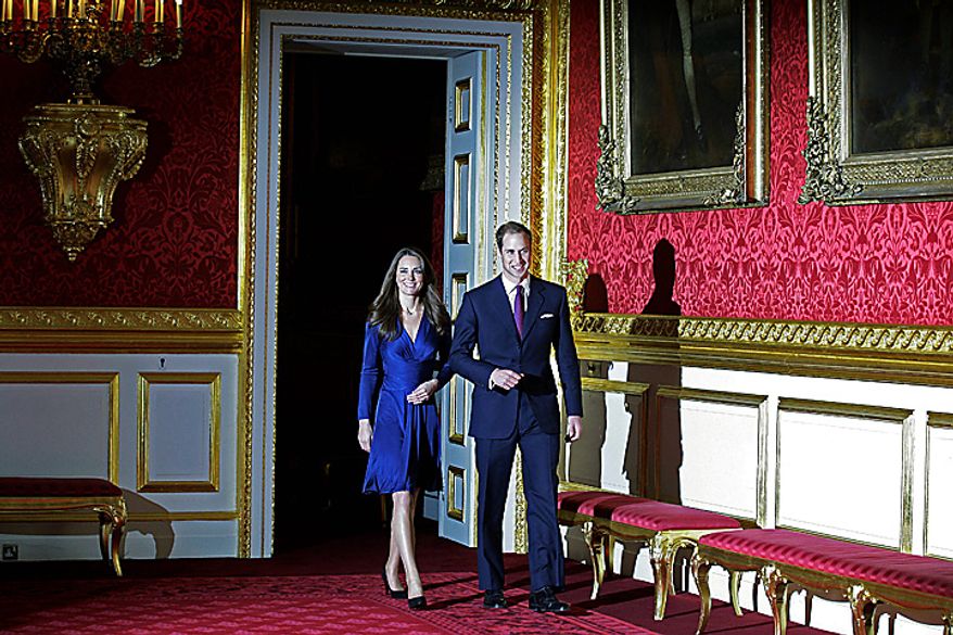 Britain's Prince William and his fiancee Kate Middleton walk into the room for a photo-call at St. James's Palace in London, Tuesday Nov. 16, 2010, after they announced their engagement. The couple are to wed in 2011. (AP Photo/Sang Tan)