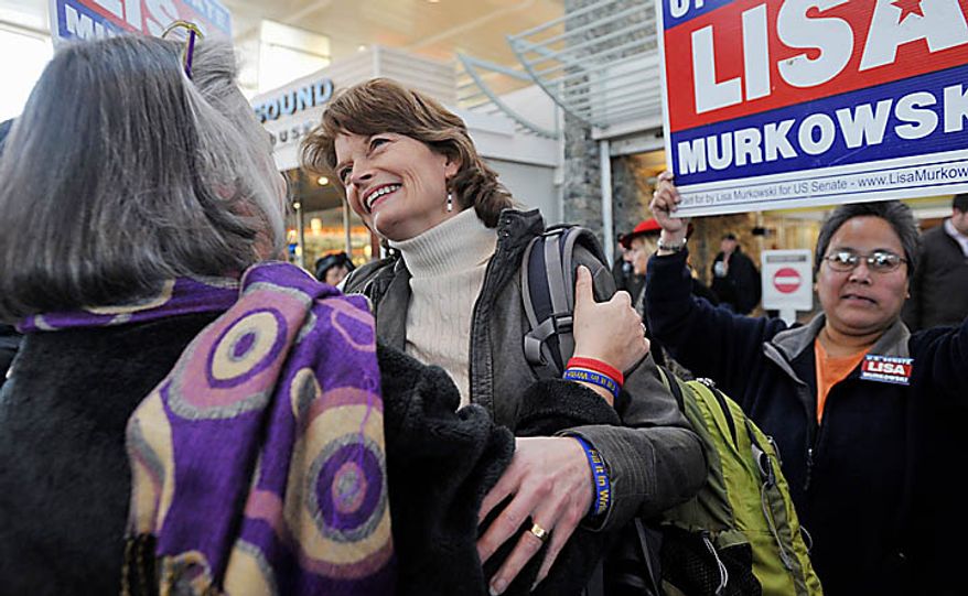 U.S. Senator Lisa Murkowski (R) Alaska, center, is greeted by her sister Carol Sturgelewski, left, upon her arrival at Ted Stevens International Airport in Anchorage Wednesday, Nov. 17, 2010. Murkowski became the first Senate candidate in more than 50 years to win a write-in campaign. The victory is a remarkable comeback for Murkowski, who lost to political newcomer Joe Miller in the GOP primary, and a humbling moment for Sara Palin, the former Alaska governor, 2008 GOP vice presidential candidate and Murkowski nemesis whose support was not enough to get Miller through an election in her own backyard. (AP Photo/Michael Dinneen)