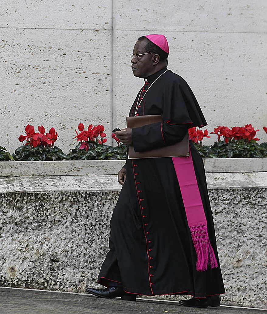 Archbishop of Kinshasa, Democratic Republic of Congo, Laurent Monsengwo Pasinya arrives to attend a meeting of cardinals summoned by Pope Benedict XVI for a day of reflection at the Vatican, Friday, Nov. 19, 2010, the day before a ceremony to create 24 new cardinals. The top agenda, religious freedom, grew remarkably timely given China's planned ordination Saturday of a bishop who doesn't have the Pope's approval. The Vatican warned China that efforts at reconciliation would be set back if bishops loyal to the pope were forced to attend the ordination. The Vatican said such actions would constitute "grave violations of freedom of religion and freedom of conscience.'' Pasinya is one of the 24 prelates that will be elevated to cardinal on Saturday. (AP Photo/Alessandra Tarantino)