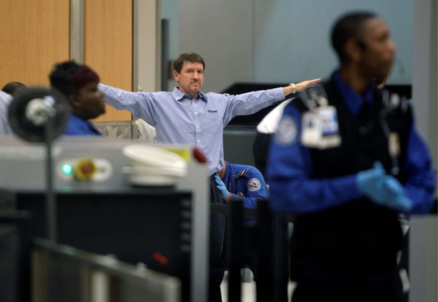 ASSOCIATED PRESS
A passenger is patted down while going through a security checkpoint at Hartsfield-Jackson Atlanta International Airport in Atlanta.