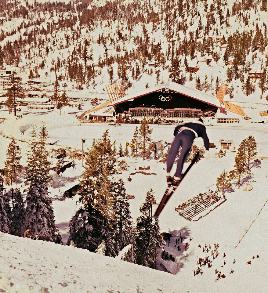A ski jumper takes to the air during the 1960 Winter Olympics at the Squaw Valley ski resort in California. Owners of the Lake Tahoe-area ski resort have agreed to sell it. (Associated Press)
