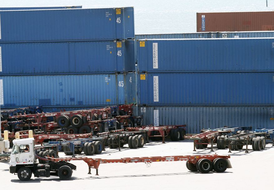In this Thursday, Oct. 7, 2010 photo, shipping containers are shown stacked at the Port of Miami in Miami. The economy grew slightly faster last summer than first thought, benefiting from stronger spending by U.S. shoppers and improved overseas sales of U.S. goods. (AP Photo/Wilfredo Lee)
