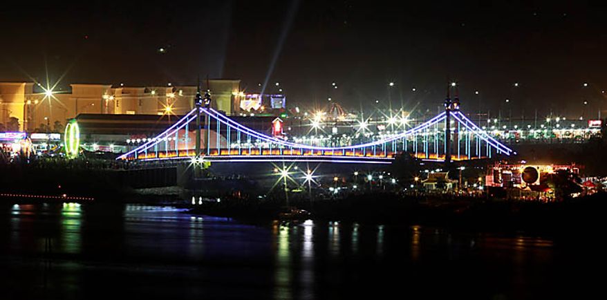 The bridge where an accident took place during the last day of celebrations of the water festival in Phnom Penh, Cambodia, Monday, Nov. 22, 2010. Thousands of people celebrating a water festival on a small island in a Cambodian river stampeded Monday evening, killing many people, a hospital official said. Hundreds more were hurt as the crowd panicked and pushed over the bridge to the mainland. (AP Photo/Heng Sinith)