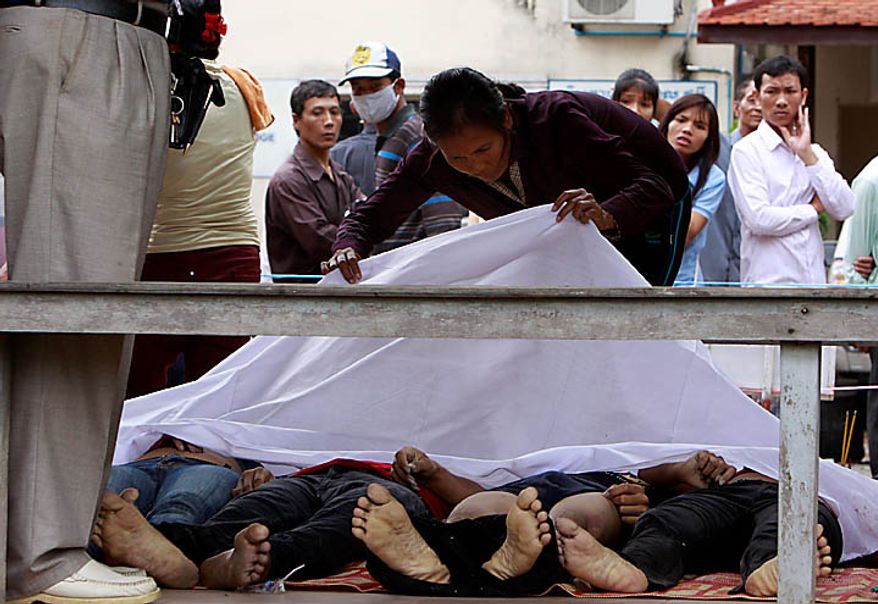 A Cambodian woman looks for her missing relative at Preah Kossamak Hospital in Phnom Penh, Cambodia, Tuesday, Nov. 23, 2010. Thousands of people stampeded during a festival in the Cambodian capital, leaving at least 349 dead and hundreds injured in what the prime minister called the country's biggest tragedy since the 1970s reign of terror by the Khmer Rouge. (AP Photo/Heng Sinith)